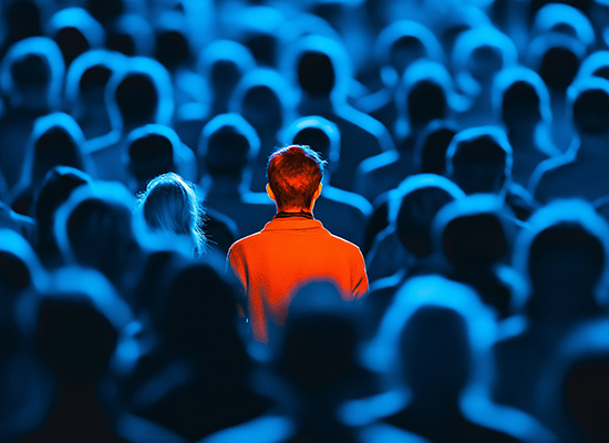 A solitary figure in an illuminated crowd, symbolizing senior isolation and the challenges of aging alone.