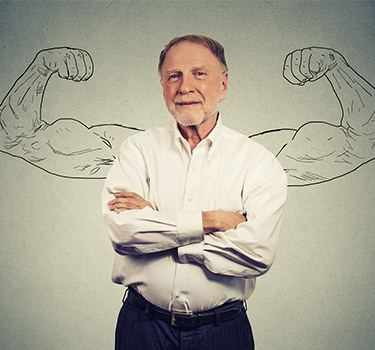 man with his arms crossed and a drawing of arms behind him flexing