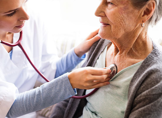 an elderly woman getting a health check up