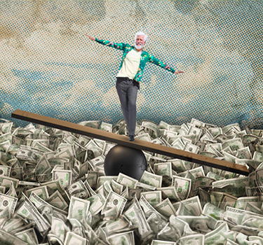 man balancing on a board above a pile of cash