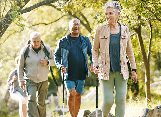 A group of retirees hiking together, symbolizing the importance of maintaining mental well-being and social connections in retirement.