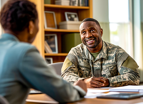 A veteran in uniform discusses retirement income planning and financial strategies with a professional advisor to maximize military benefits.