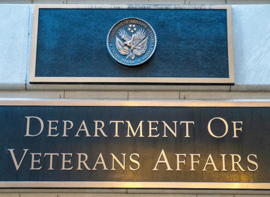 The Department of Veterans Affairs sign represents the central role of the VA in providing pensions, disability compensation, and health care benefits for veterans.