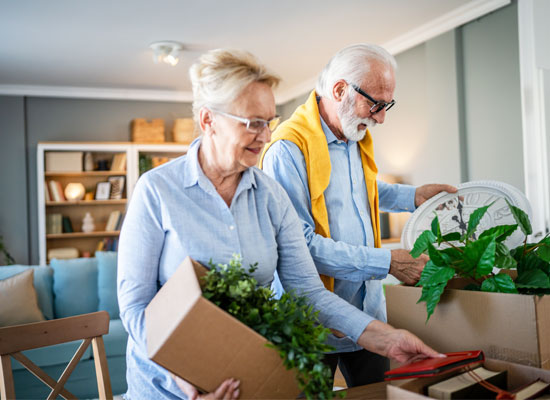 Retirees organizing their belongings while planning for retirement
