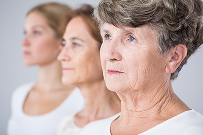 Three women of different ages from young to elderly