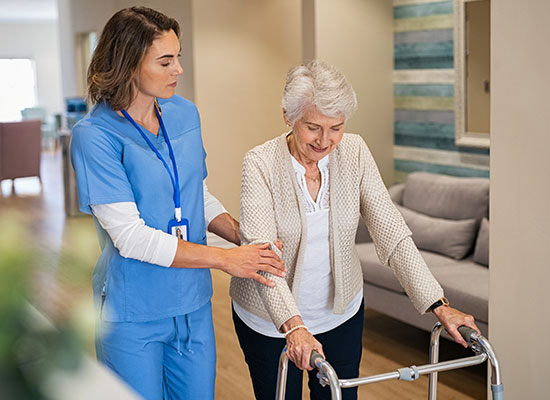 a senior getting assistance in an assisted living facility